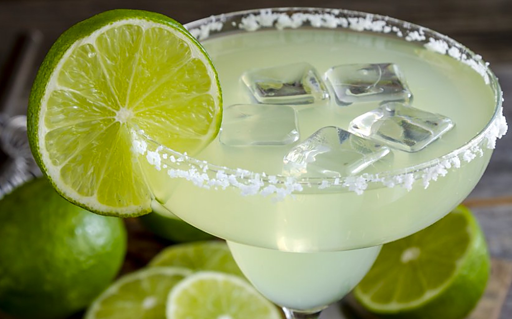 Margarita on the rocks with a salted rim and a fresh lime wheel